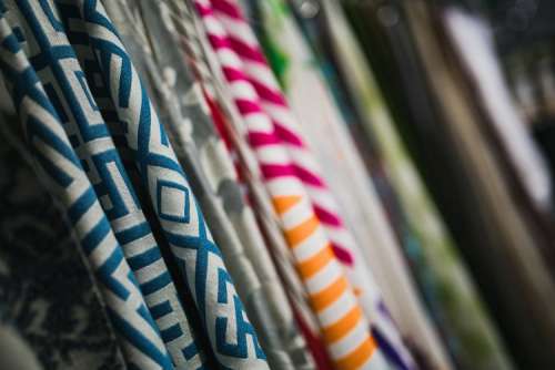 Collection of design fabrics on hangers