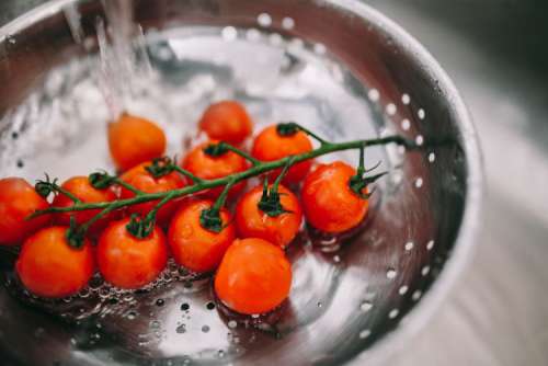 Washing vegetables in colander