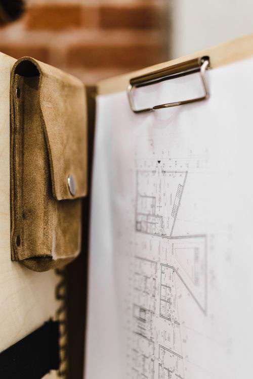 Architecture plans in an elegant leather bag