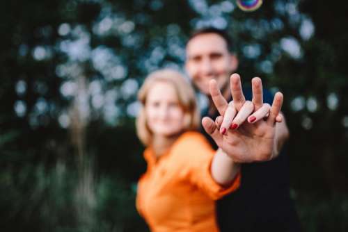 Young couple holding hands outdoors