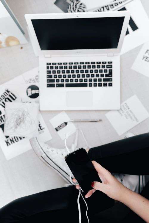 Femine Workplace with White Laptop