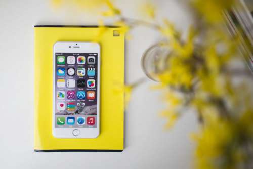 White smartphone with yellow flowers