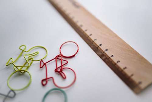 Bicycle paper clips and a wooden ruler
