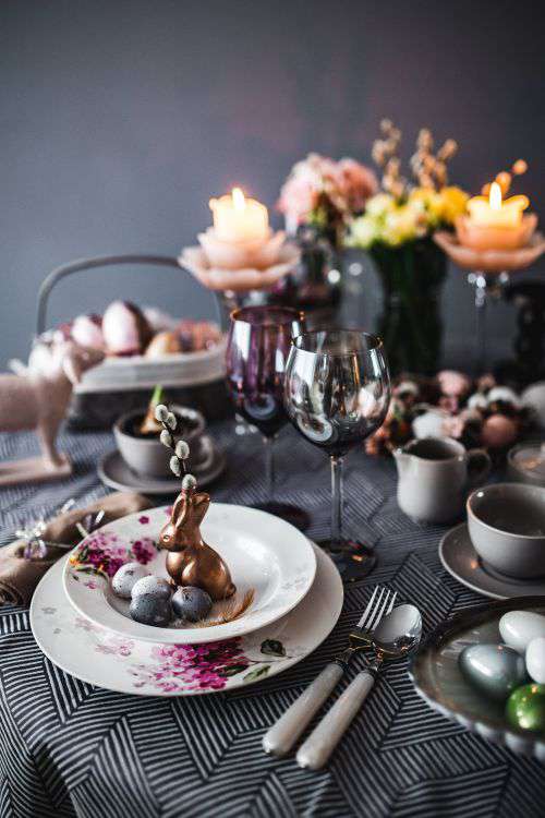 Round dinner table decorated with easter motifs