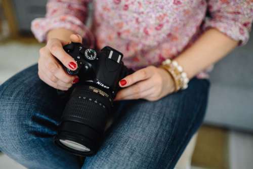 Woman in pink with her camera