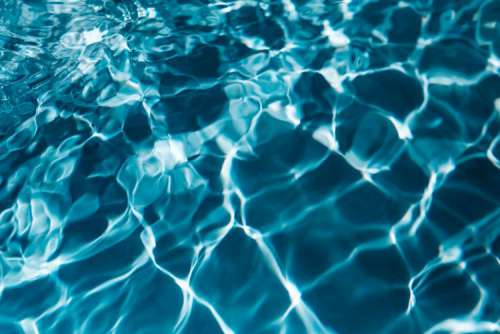 Wavy water surface in a swimming pool
