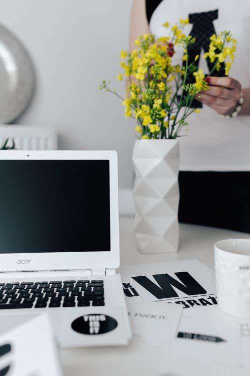 Workspace with yellow flowers