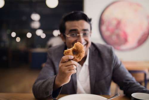 Man Holding Donut Free Photo