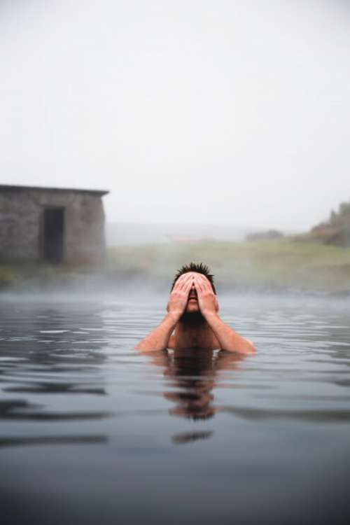 Man in Volcanic Pool Free Photo