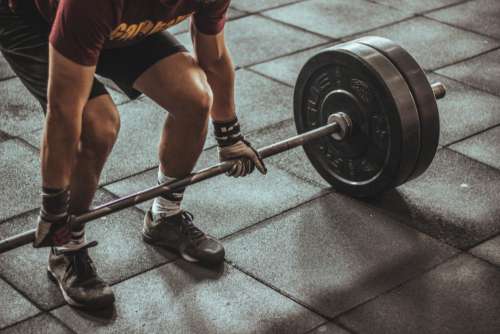 Man Lifting Weights Gym Workout Free Photo