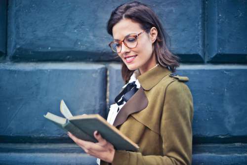 Woman Glasses Reading Book Free Photo