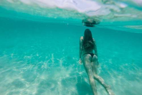 Woman Swimming Underwater Free Photo