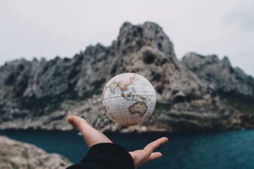 Man Throwing Globe Free Photo