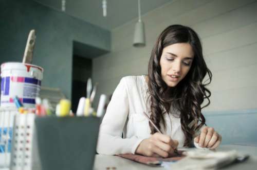 Young Woman Painting Desk Free Photo