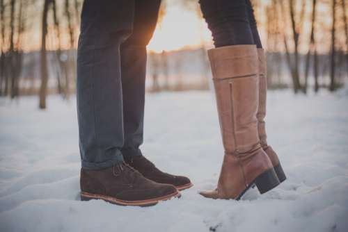 Man Woman Kiss Snow Boots Sunset Free Photo