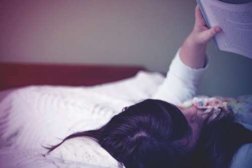Woman Reading Book Bed Free Photo