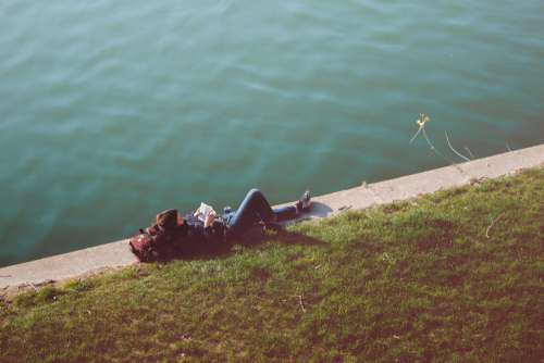 Relaxed Woman Reading River Free Photo