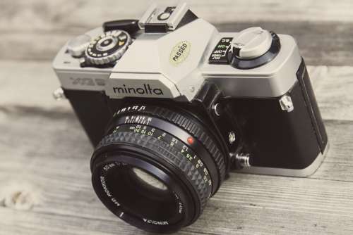 Minolta Camera on Wooden Surface Free Photo