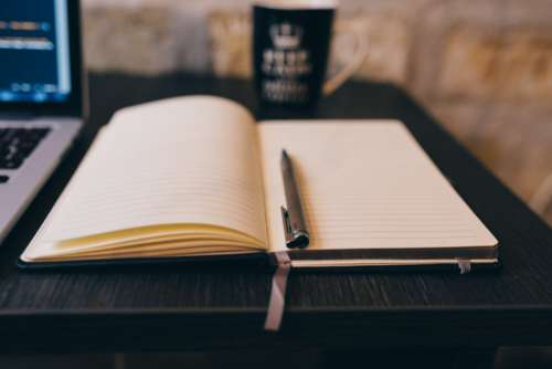 Notepad, MacBook and Coffee Mug Free Photo