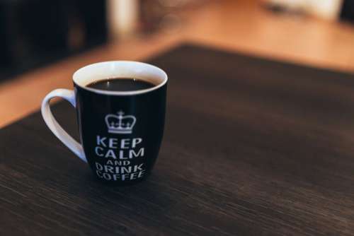 Black & White Coffee Mug on Desk Free Photo