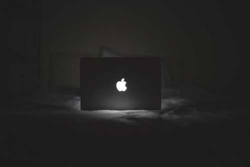 B&W MacBook Glowing Apple Logo Free Photo