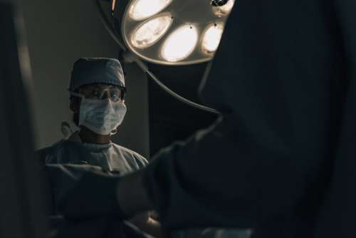 Surgeon in Scrubs Operating Free Photo