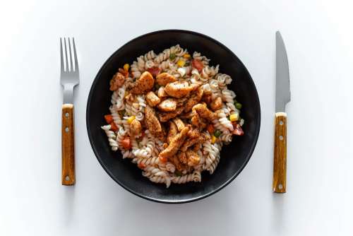 Light Pasta with Grilled Chicken Breasts Strips Free Photo