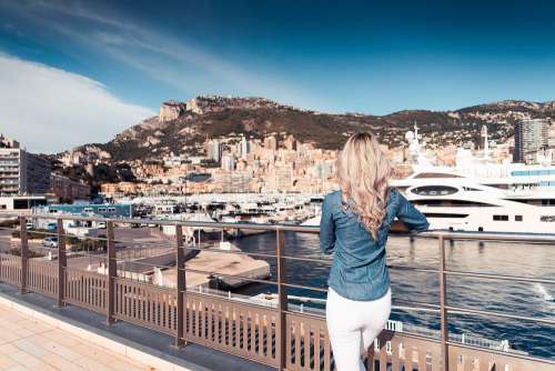 Woman Looking at Boats in Port of Monaco Harbor Free Photo