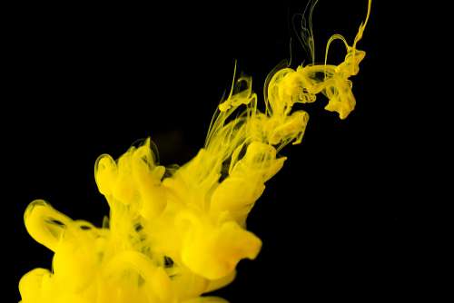 Yellow Ink in Black Water Free Photo