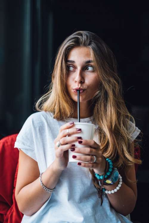 Funny woman drinking coffee 