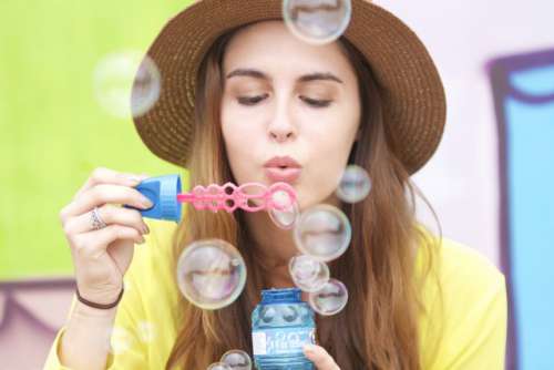 Bubble blowing girl