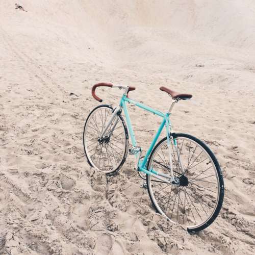 Retro bike on a sand background 