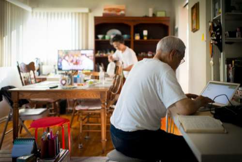 Elder man on computer