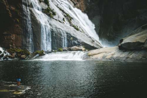 Tiny people in a waterfall