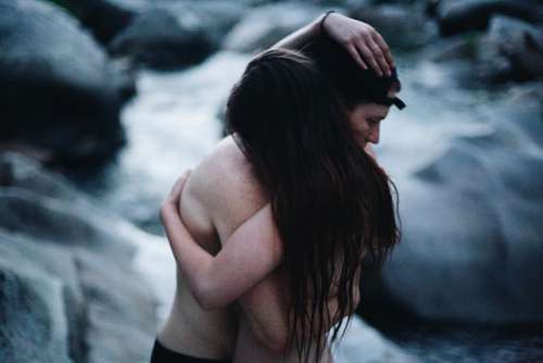 Two lovers embracing within mother nature