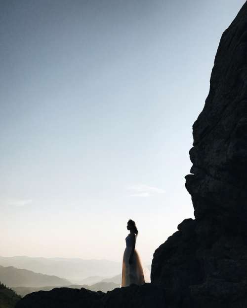 Bride silhouette in the mountains