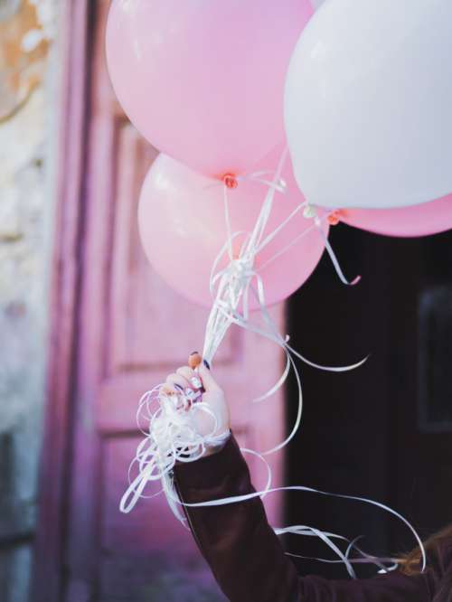 Birthday girl with pink balloons 