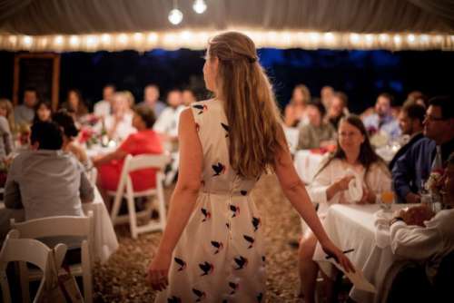 Girl standing at a wedding reception 