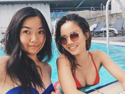 Sisters take a selfie by the pool