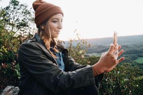 Girl using a mobile device in Fall