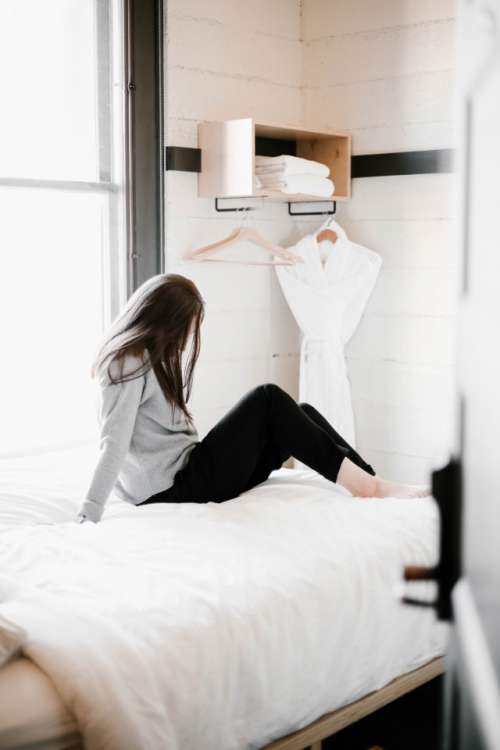 Girl in a modern, boutique hotel room 