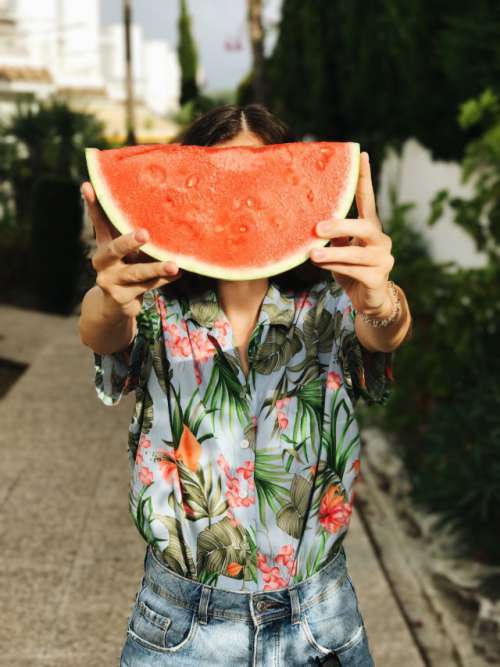 Girl holding a slice of watermelon 