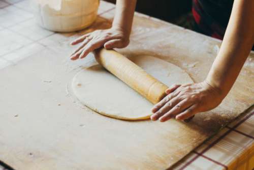 Rolling the dough with a rolling pin