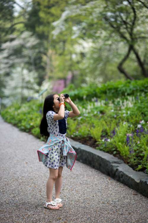 Girl looking through binocular