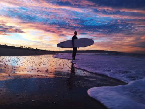 Sunrise surfing session at Manhattan Beach, CA