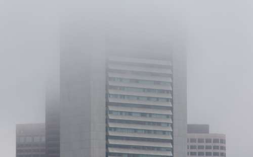 city fog buildings mist brick