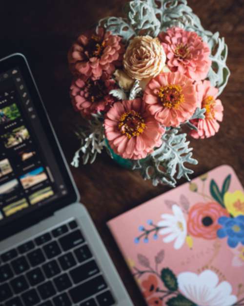 laptop desk flowers table bouquet