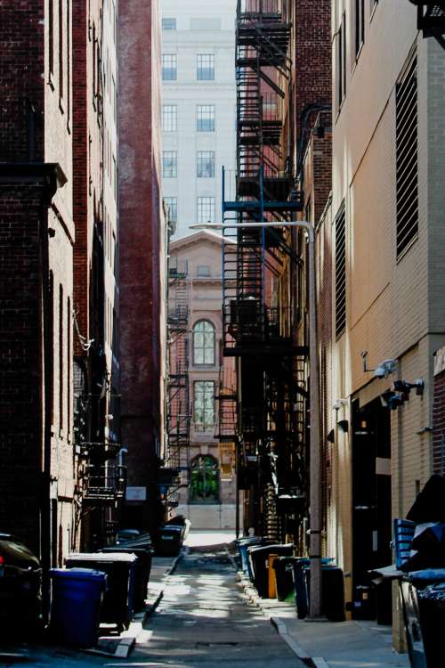 city fire escape buildings alley
