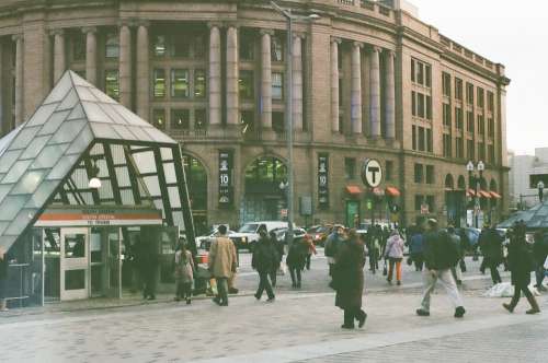 people walking city crossing street