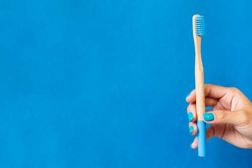 Bamboo Toothbrush On Blue Photo
